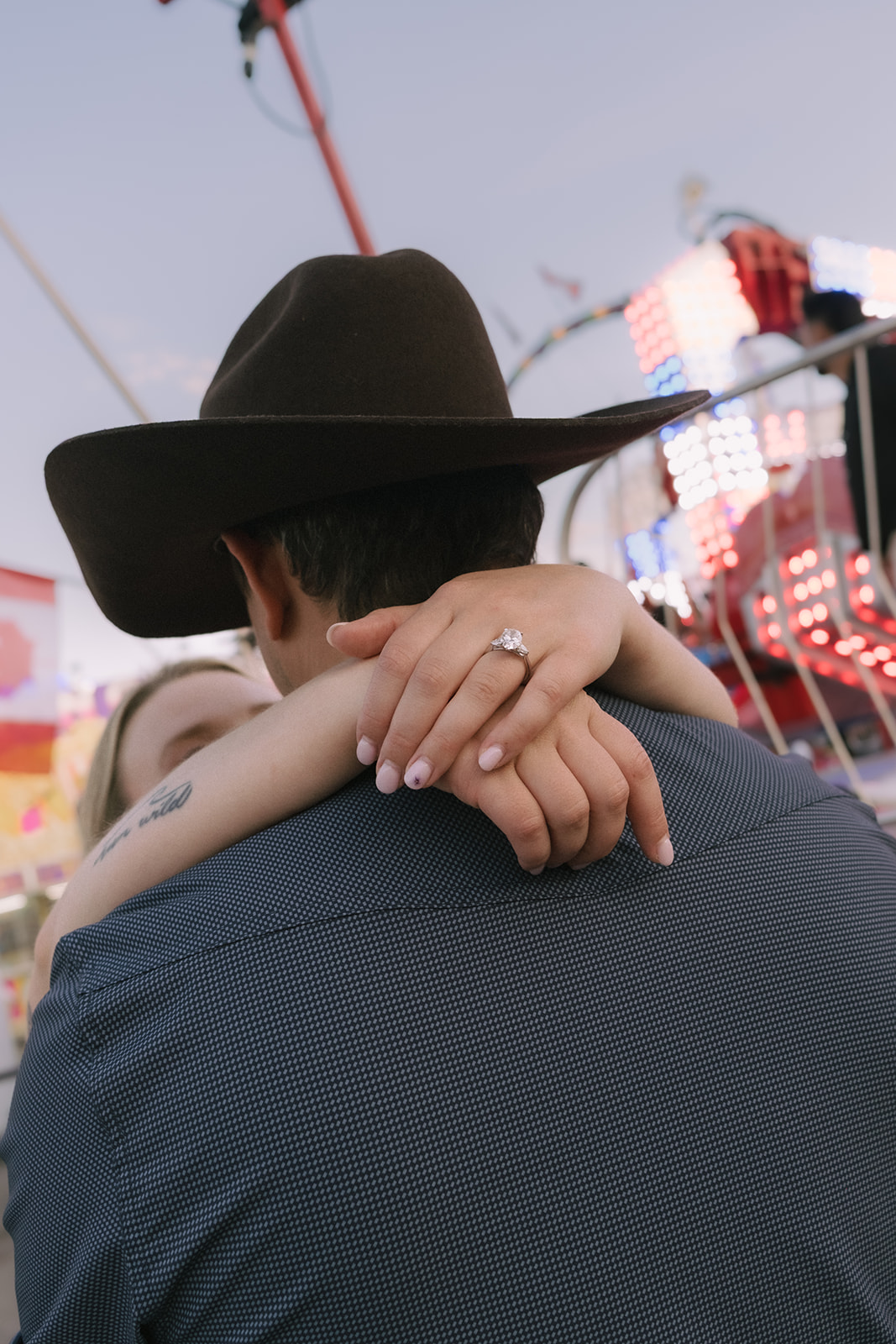 Christie's ring, arms around Kevin's shoulders